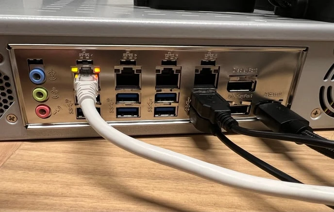 Keyboard, mouse, and HDMI cable plugged into the back of the robot